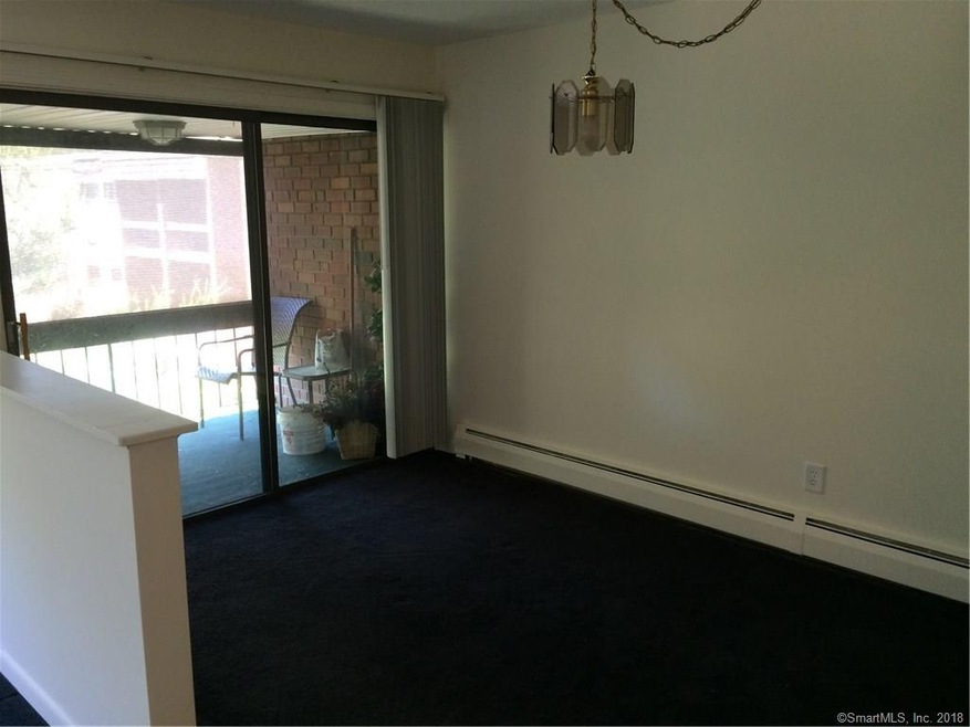 Dining area with slider to covered balcony