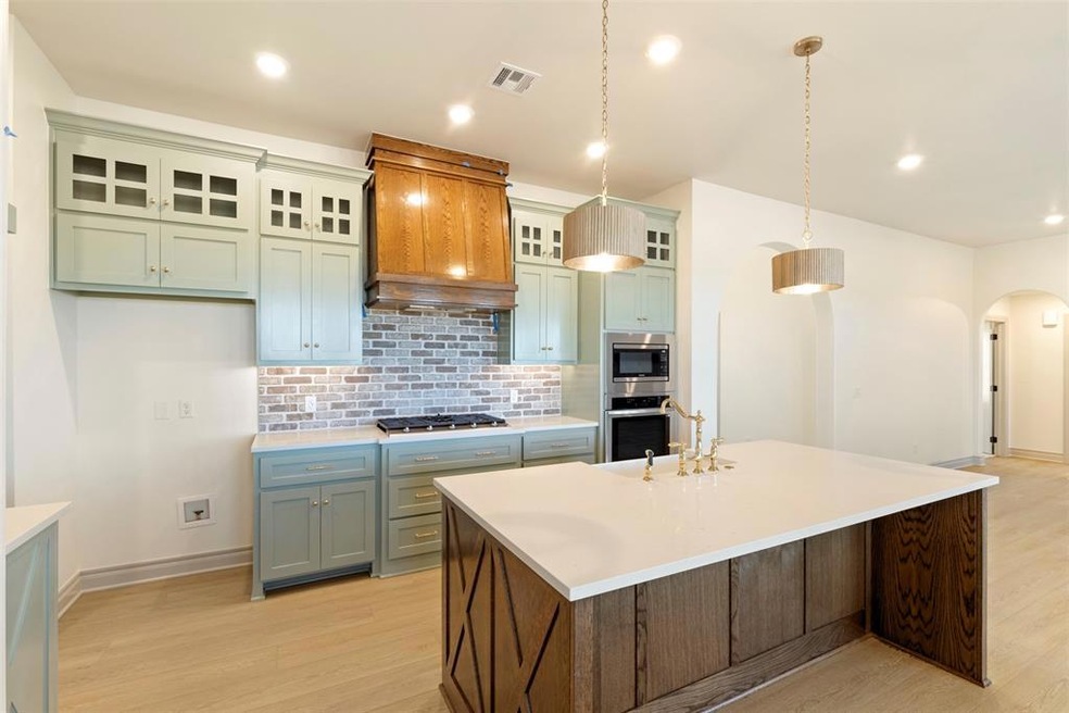 Kitchen featuring light hardwood / wood-style floo