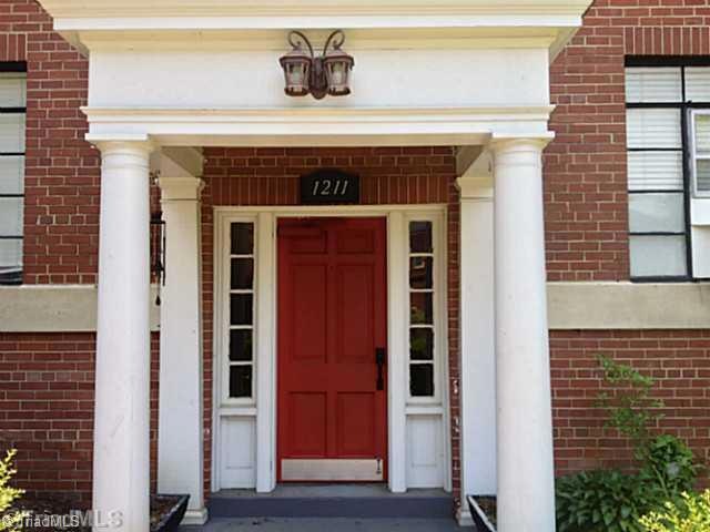 Exterior Front. Bright red door greets you from courtyard entry.  Condo is also accessible from Main Street with key.