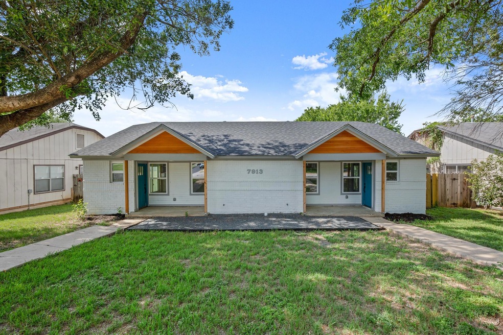 View of front facade featuring a shingled roof, c