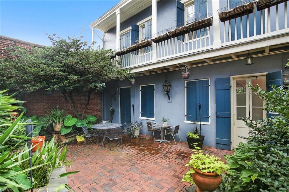 Enter condo #7 through the lush courtyard and into the carriage house