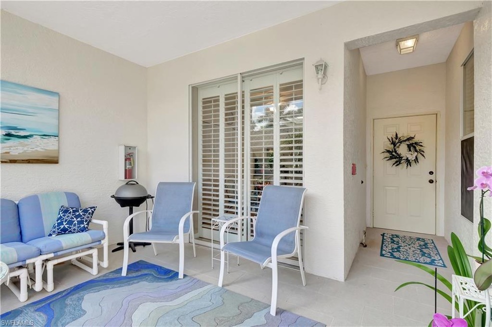 Doorway to property with a patio area