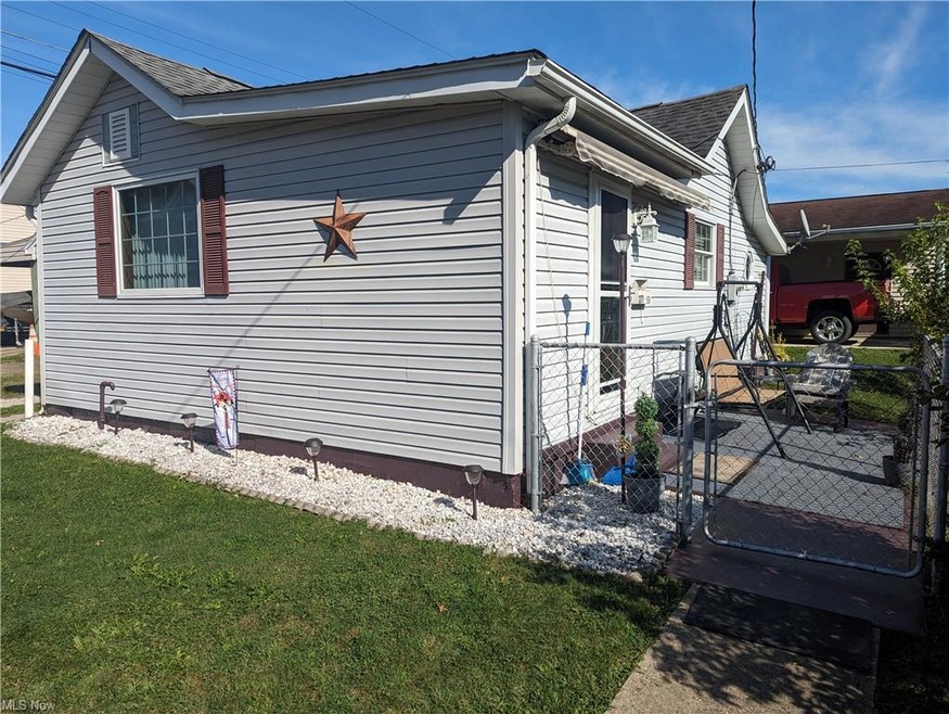View of home's exterior featuring a yard