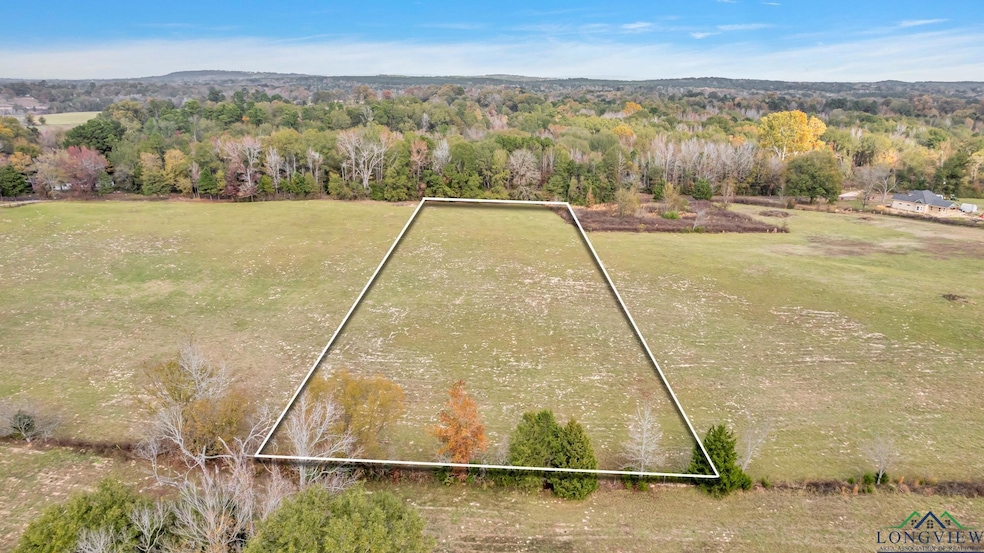Aerial view of property and surrounding area with 