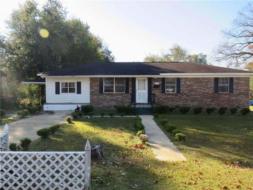 Single story home with a front yard