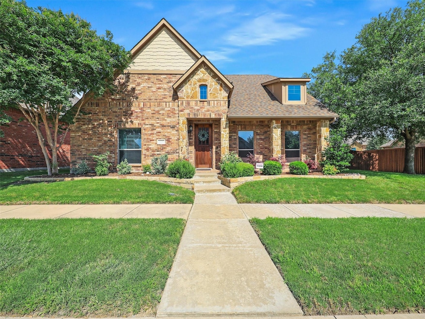 View of front of property with a front yard