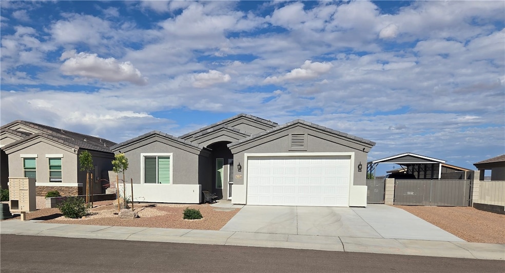 Ranch-style home with driveway, stucco siding, and