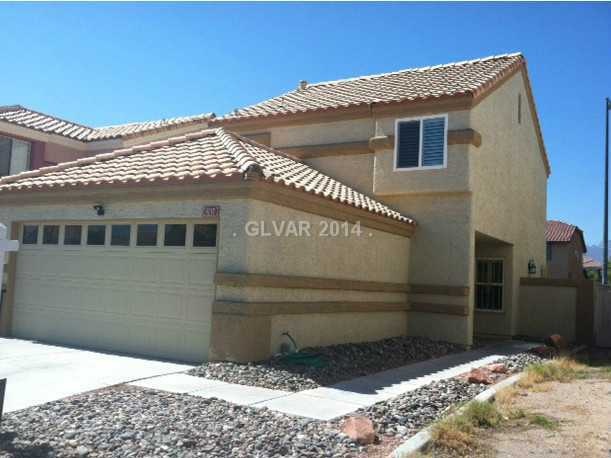Facade/Exterior Front. Front view of home and dese