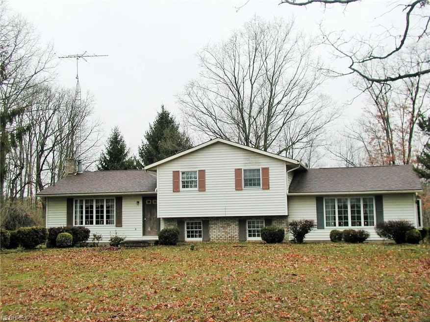 Amazing setting on 13.6 acres of woods and tons of