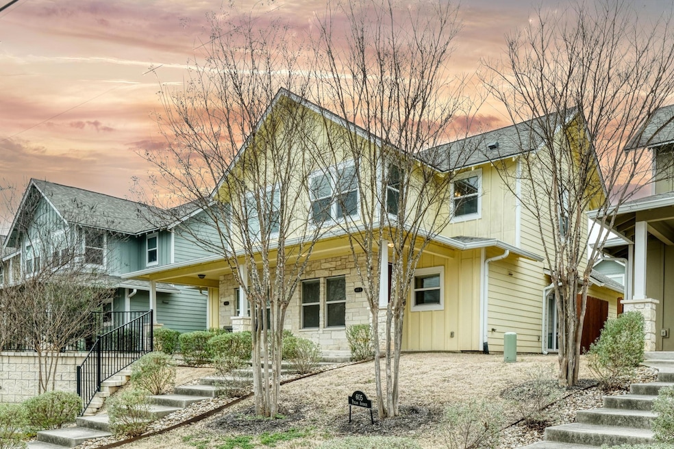 Traditional-style home with a porch, stairs, and board and batten siding