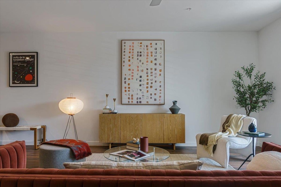 Living area featuring baseboards and wood finishe