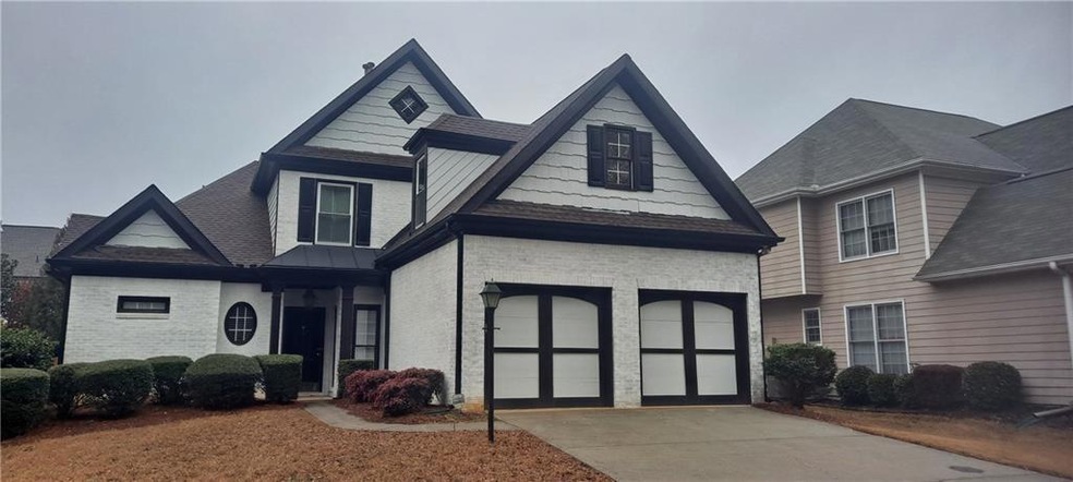 View of front of property with a garage