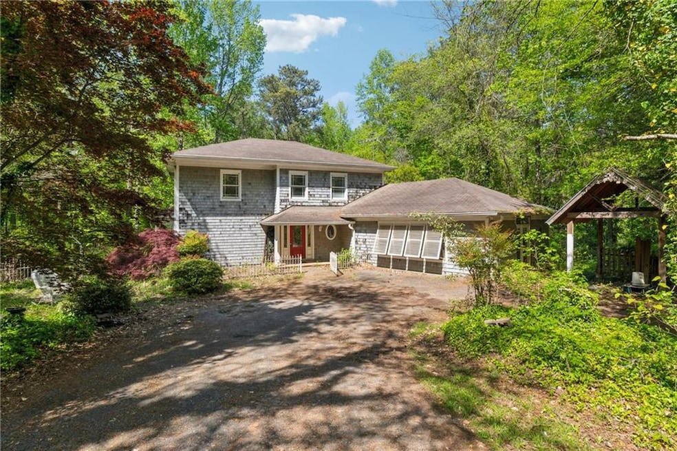 View of front of property featuring dirt driveway