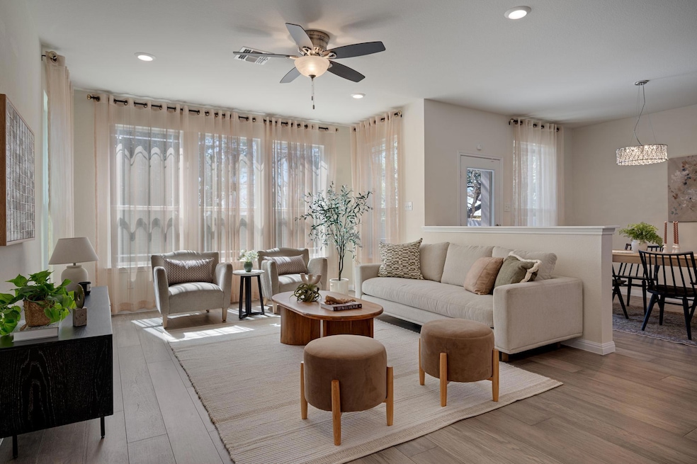 Living area with visible vents, recessed lighting