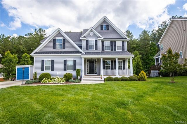 Stunning home in Harpers Mill in the desirable Longlands section.  Enjoy the country front porch, beautiful, irrigated lawn, concrete drive and walkway.