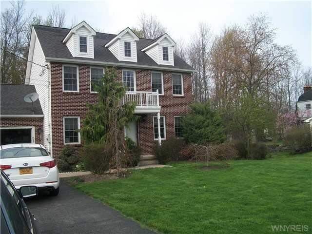Exterior Front traditional colonial on treed priva