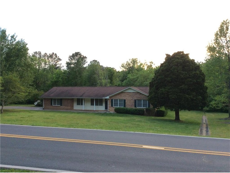 BRICK RANCH HOME IN CITY ON LARGE LEVEL LOT