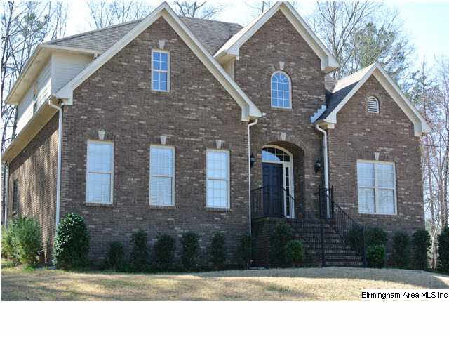 FRONT of 3-SIDE BRICK HOME