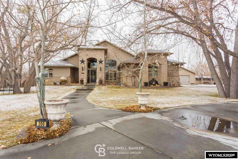 Features Grand Covered Entry and Circle Driveway