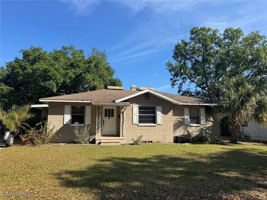 View of front of property featuring concrete block