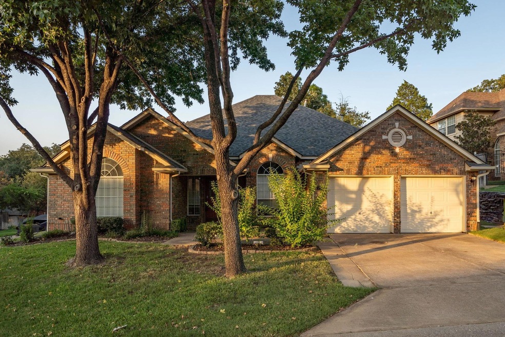 View of front facade with a garage and a front yar