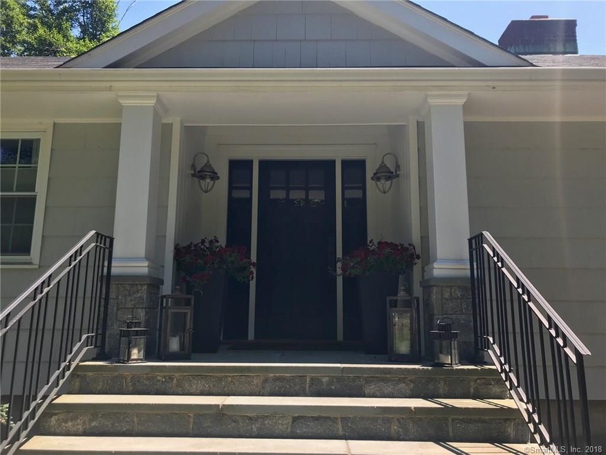Columns and stone present a gracious front entry.