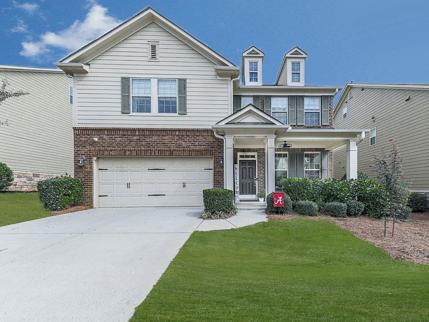 View of front of property with a garage and a fron
