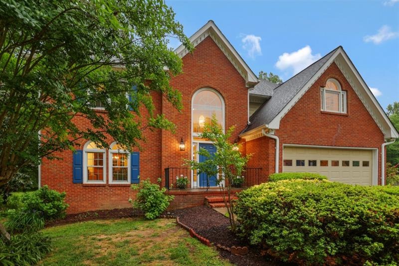 Welcome home to this gorgeous brick-front traditio
