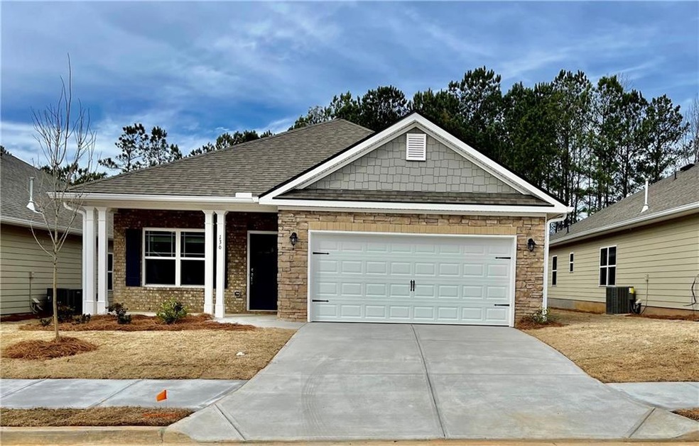Craftsman house featuring central AC and a garage