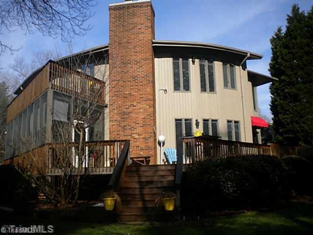 Exterior Back. Lots of windows and deck on the rear of the house to enjoy the lake view.