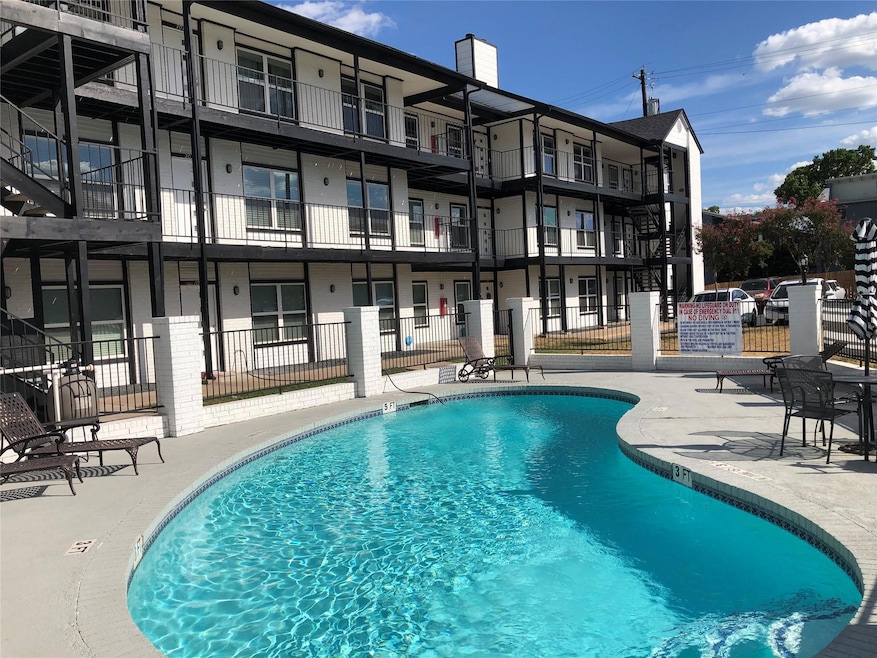 Pool with fence and a patio area