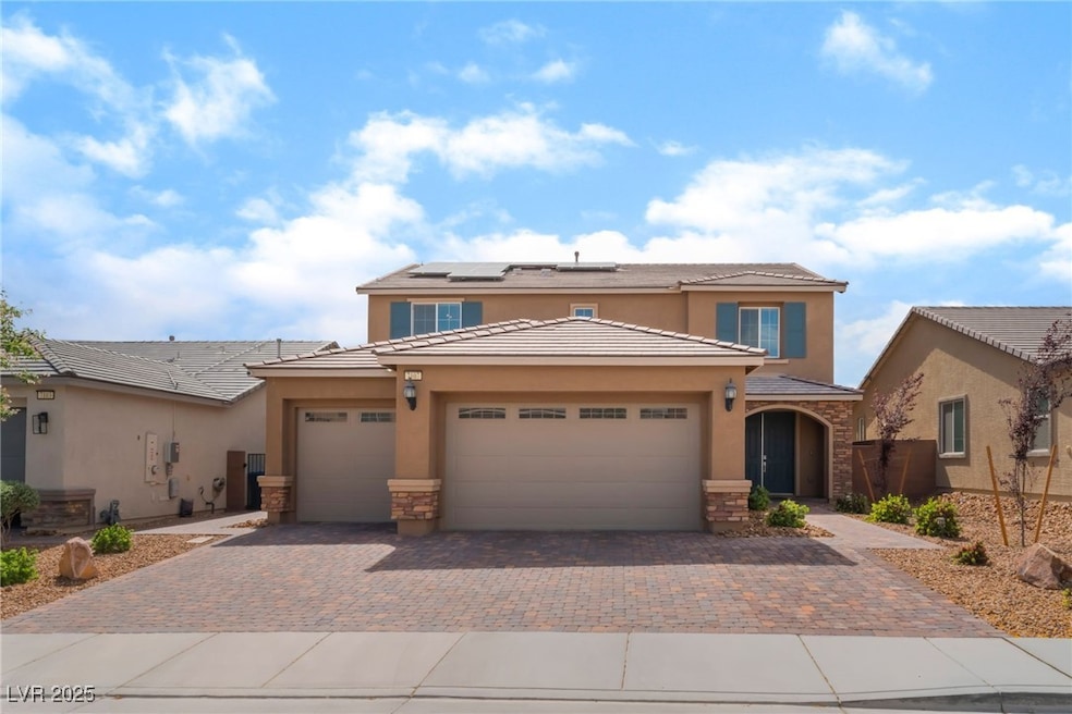View of front of property with stucco siding, ston
