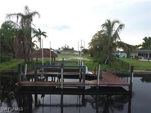 Dock featuring a water view and boat lift