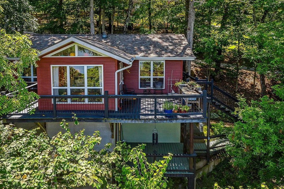 Perched Hi for great views of Beaver Lake, This home has decks across the front, close proximity to the lake, a GREAT lakeview in a community of good neighbors
