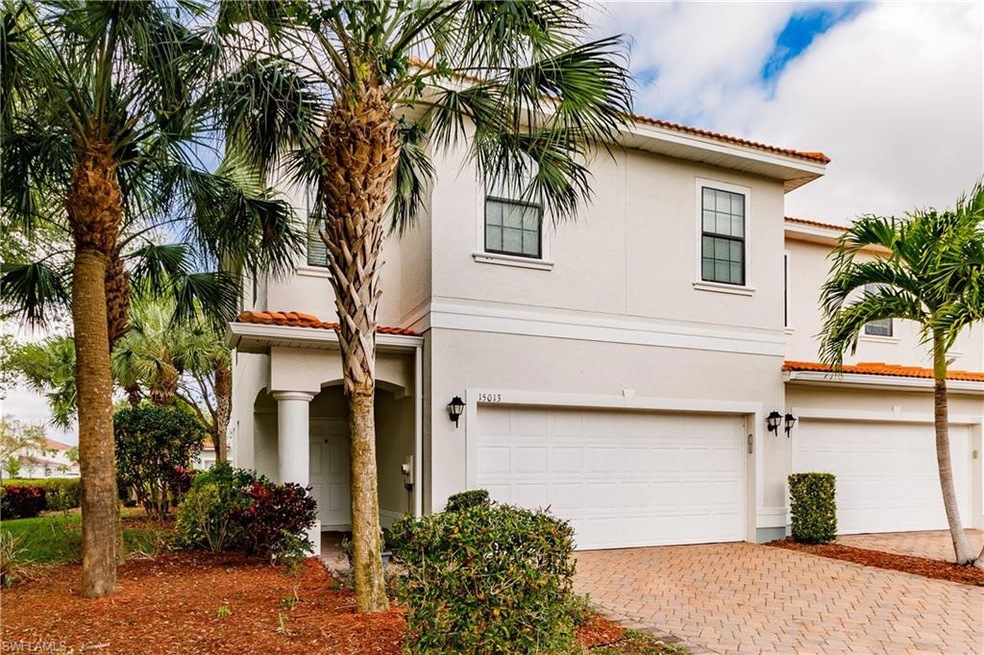 Front view, paver driveway & 2 car garage