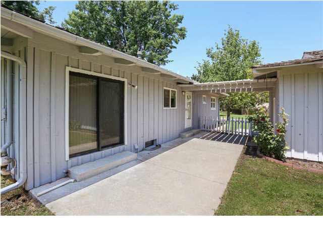 Patio area between home and garage, sliding doors 