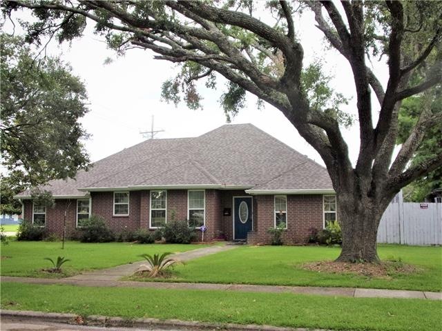 Exterior front:  Corner lot with several large tre