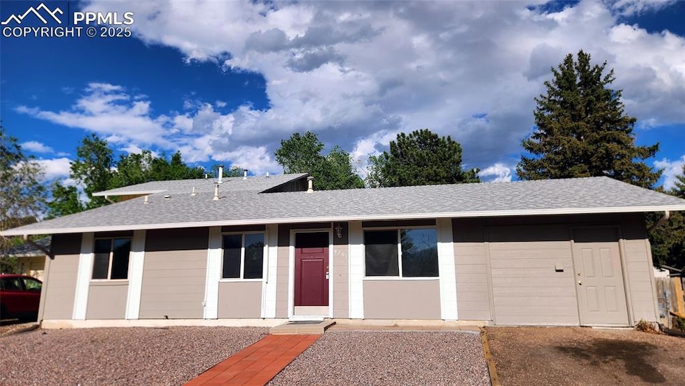 View of front of house featuring a shingled roof