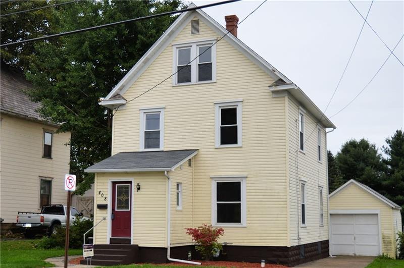Front of home with detached garage