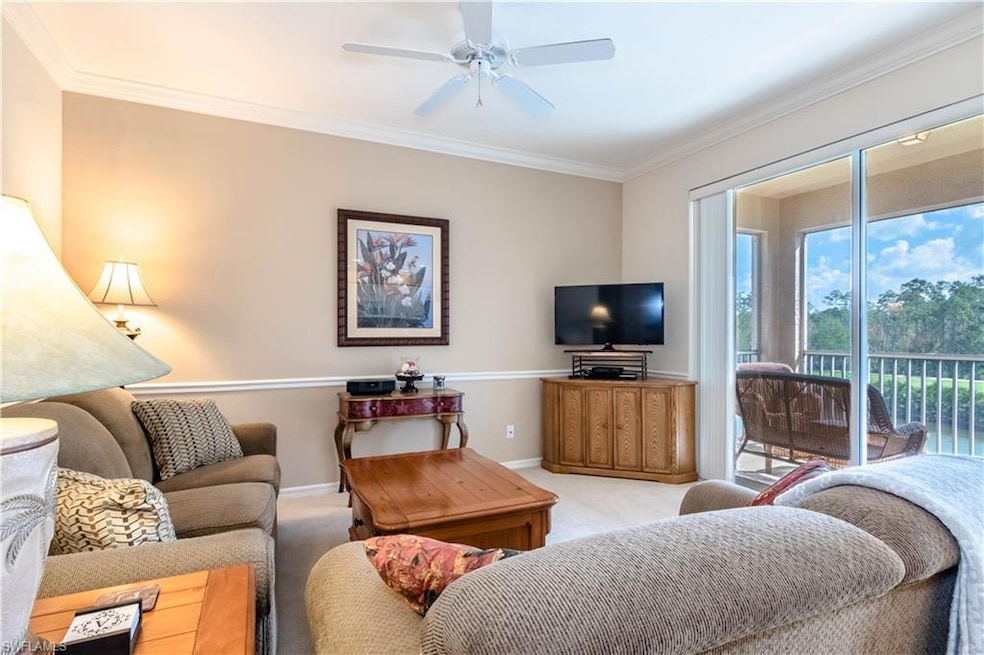 Living room with lanai view of fairway