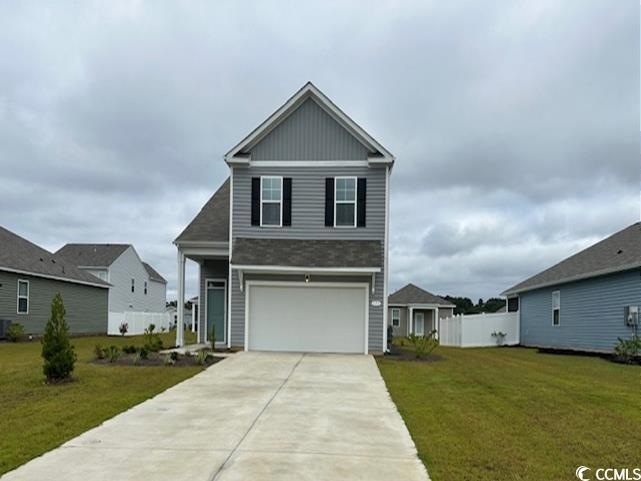 View of front of house featuring a garage and a fr
