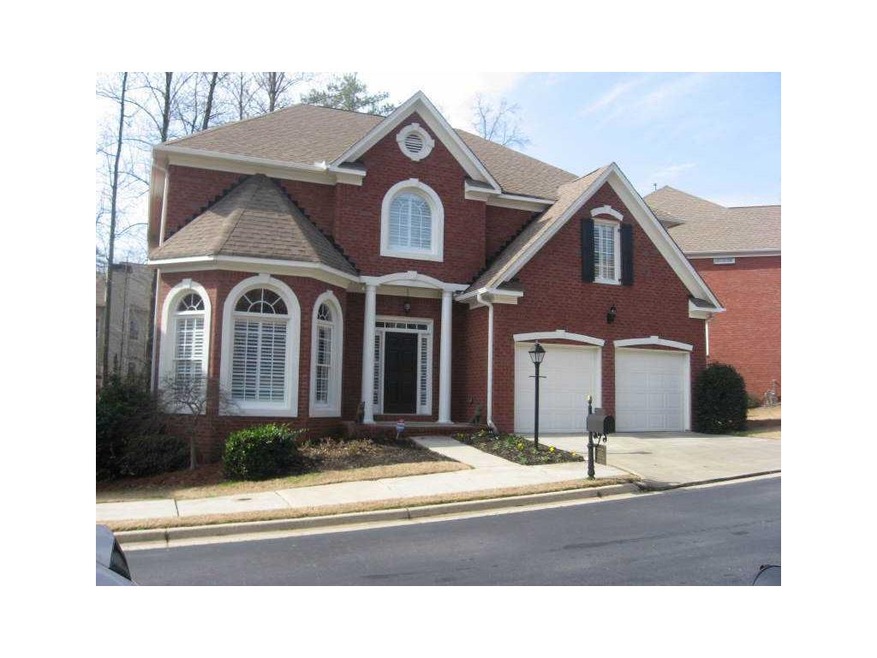 Exterior Front. Custom Built Three Sided Brick Bea