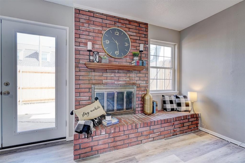 Living room with light hardwood / wood-style floor