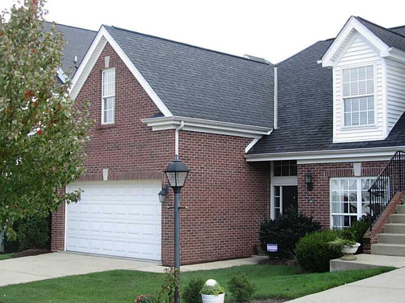 Exterior Front. All brick exterior end unit with f
