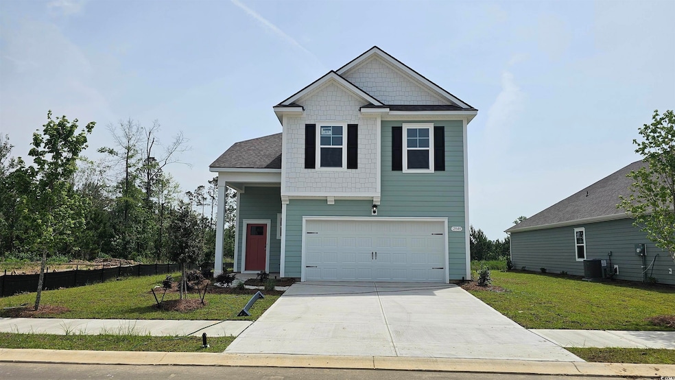 Craftsman house featuring central AC unit, concrete driveway, and an attached garage