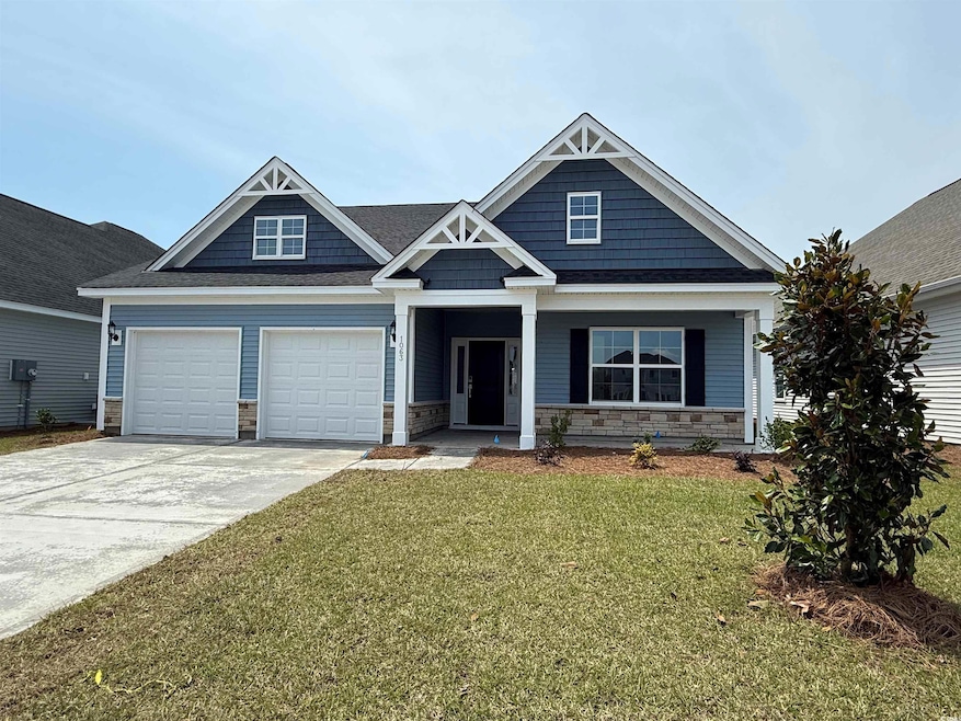 Craftsman-style home with stone siding, a front lawn, concrete driveway, a garage, and a porch