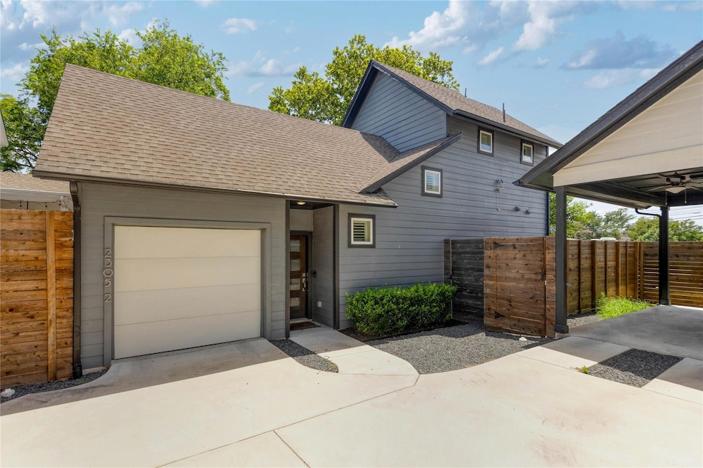 View of front of house featuring a shingled roof,