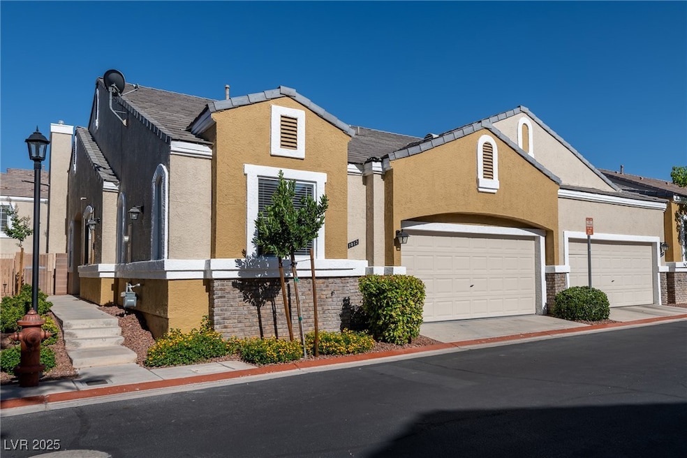 View of front facade featuring stucco siding, an a