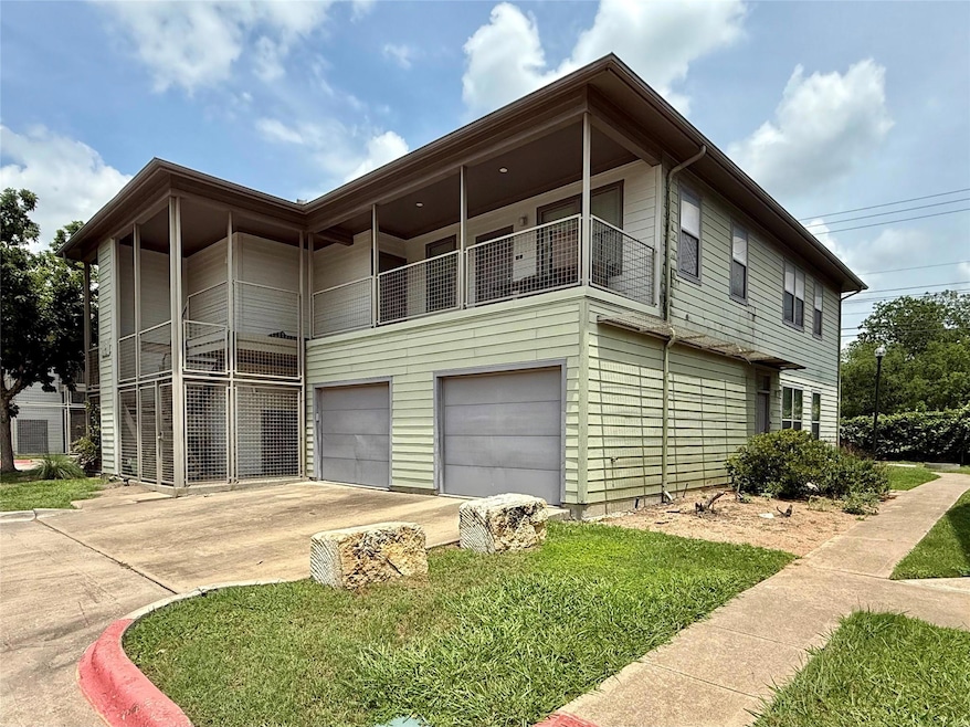 View of side of property featuring an attached ga