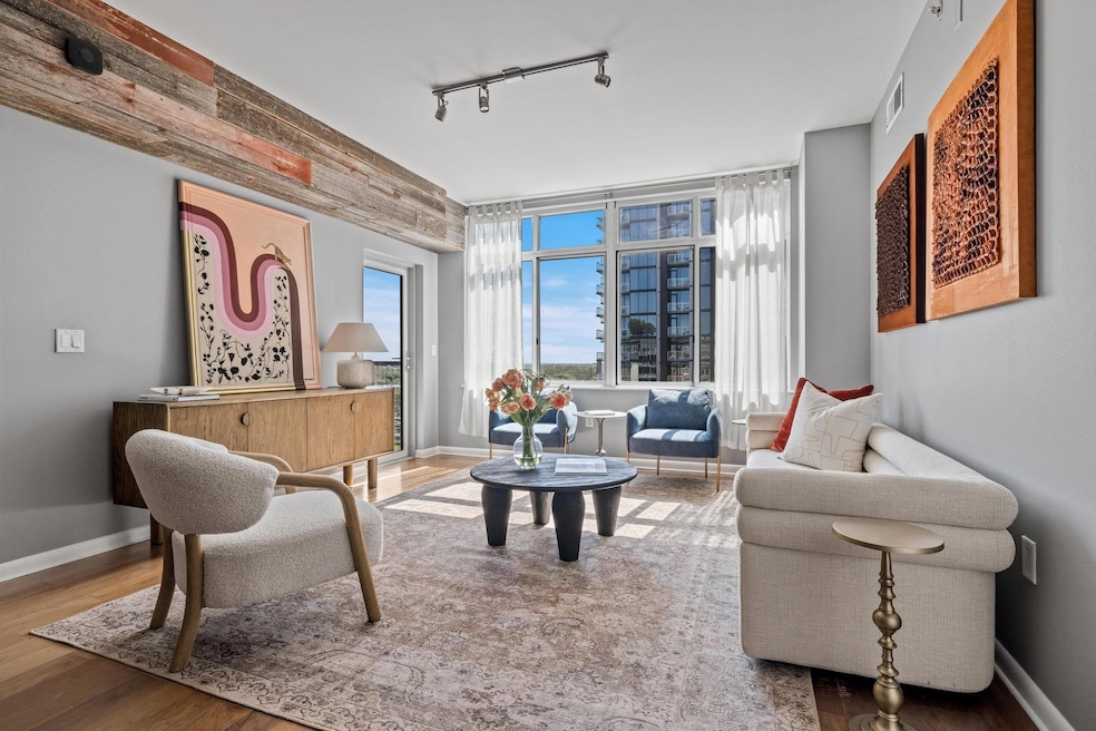 Living area with visible vents, track lighting, b